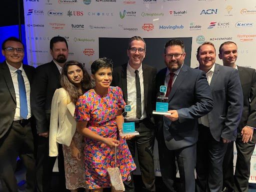 Network for Learning team accepting two awards at Compare Awards 2022.