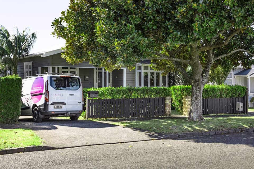 Chorus van parked outside suburban New Zealand house